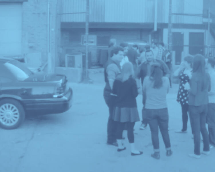 Back alley of the ImprovOlympic where teams are warming up before shows and getting notes afterwards.